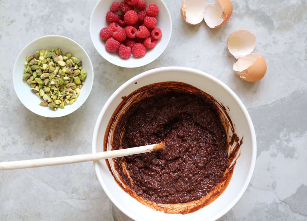 melted chocolate raspberries and pistachio for low carb dessert